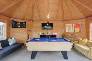 a room with a pool table in a house at Large Holiday Home perfect for family gatherings in Angus