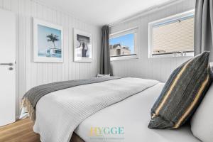 Schwimmendes Haus Hygge Olpenitz客房内的一张或多张床位