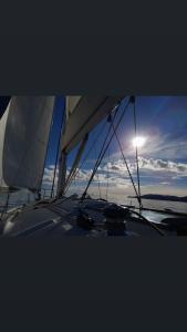a view of the wing of a boat with the sun at Bed & Boat Holiday in La Spezia
