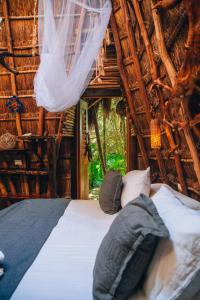 Postel nebo postele na pokoji v ubytování Ikal Tulum Hotel