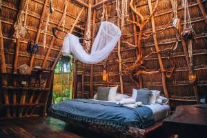 Postel nebo postele na pokoji v ubytování Ikal Tulum Hotel