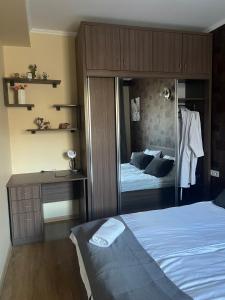 Ένα ή περισσότερα κρεβάτια σε δωμάτιο στο Bakuriani K2 Apartment