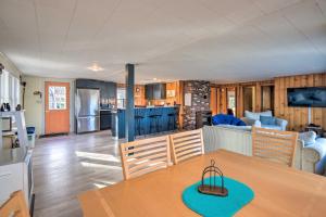 a kitchen and a living room with a table and chairs at Updated Bristol Lakehouse with Kayaks and Beach Access in Bristol