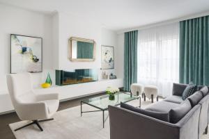 a living room with a couch and a table at The Wallace Hotel in New York