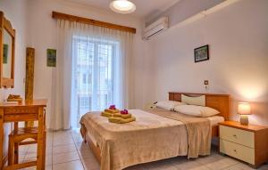 A bed or beds in a room at Maro Apartments Arillas Corfu