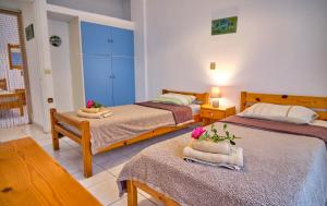 A bed or beds in a room at Maro Apartments Arillas Corfu