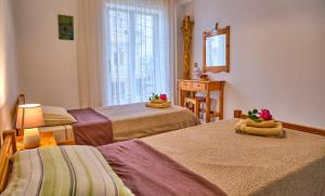 A bed or beds in a room at Maro Apartments Arillas Corfu