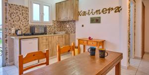 A kitchen or kitchenette at Maro Apartments Arillas Corfu