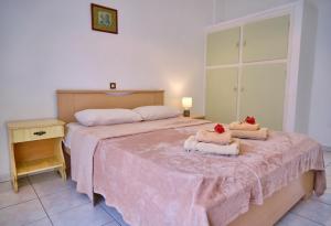 A bed or beds in a room at Maro Apartments Arillas Corfu