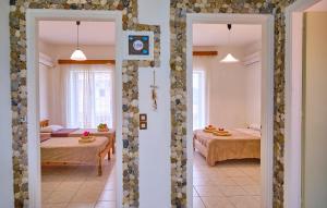 A bed or beds in a room at Maro Apartments Arillas Corfu