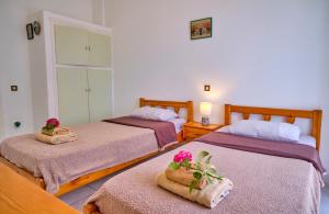 A bed or beds in a room at Maro Apartments Arillas Corfu