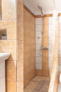 a bathroom with a shower and a sink at Boutique Apartment with ParkView in Heraklio Town +45 photos