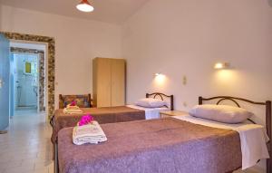 A bed or beds in a room at Maro Apartments Arillas Corfu