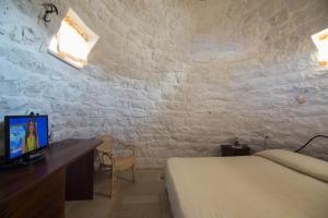Llit o llits en una habitació de Bed and Breakfast Trulli San Leonardo