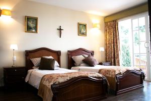 Postel nebo postele na pokoji v ubytování Condominio Hacienda Shangrila