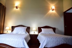 Postel nebo postele na pokoji v ubytování Condominio Hacienda Shangrila