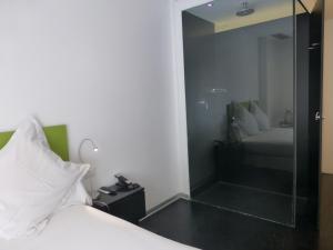 Posteľ alebo postele v izbe v ubytovaní Mayerling Hotel