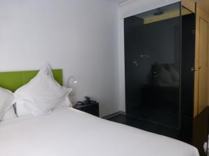 Posteľ alebo postele v izbe v ubytovaní Mayerling Hotel