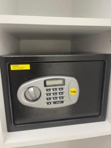 a microwave oven with the door open on a shelf at Dalyan Risus Suite in Çeşme