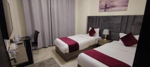 Postel nebo postele na pokoji v ubytování Golden Hotel