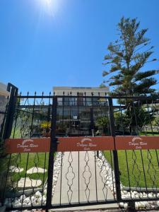 a gate at the entrance to a park at Dalyan Risus Suite in Çeşme