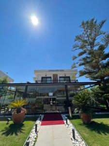 a building with a walkway in front of it at Dalyan Risus Suite in Çeşme