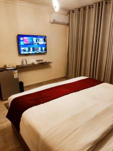 Postel nebo postele na pokoji v ubytování Golden Hotel