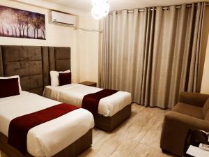 Postel nebo postele na pokoji v ubytování Golden Hotel