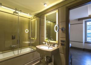 a bathroom with a sink and a shower at Hotel Balestri - WTB Hotels in Florence