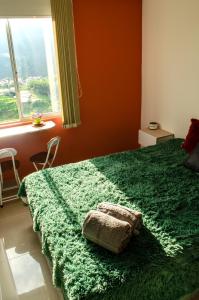 Кровать или кровати в номере Vista al Mar Verde de Armenia con parqueadero privado