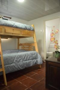 a bedroom with two bunk beds in a room at Finca Verde Vivo in Tena