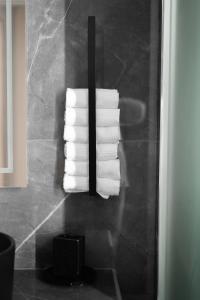 a stack of folded towels in a bathroom at Rodon Premium in Kalavrita