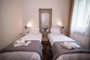 Ένα ή περισσότερα κρεβάτια σε δωμάτιο στο Rodon Premium
