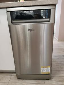 a stainless steel dishwasher in a kitchen next to a counter at Markoni in Sliven