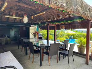 a dining area with a table and chairs on a patio at TRADEWINDS VILLAS in Port Vila