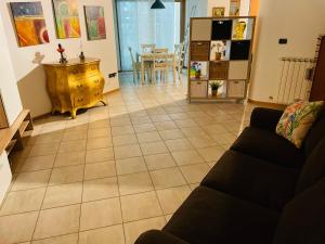 a living room with a couch and a table at Casa Vacanze Cau de Mezo in Marina Julia
