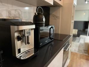 a coffee maker sitting on top of a kitchen counter at HOME COSY in Limoges