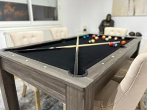 a pool table in a living room with afits at HOME COSY in Limoges