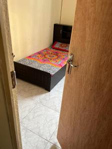 an open door to a room with two beds at Stay at gomeetingwith in Sharjah