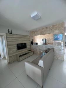 Televisyen dan/atau pusat hiburan di Apartamento Beira Mar Arroio do Silva - 2 quartos - nº42