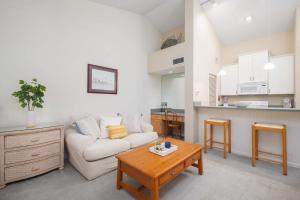 a living room with a white couch and a table at Summer Place 671 in Ponte Vedra