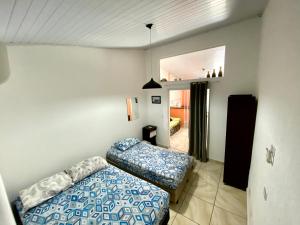 Katil atau katil-katil dalam bilik di Sunset Maresias - Casas e Chalés CG