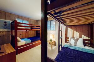a bedroom with two bunk beds in a house at Farmhouse on the Road in Wilmington