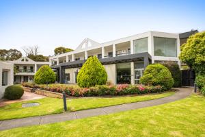 A garden outside Doncaster Apartments by Nightcap Plus