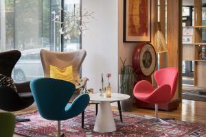 a living room with three chairs and a table at Best Western Hotel Halland in Kungsbacka