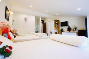 Postel nebo postele na pokoji v ubytování Lan Mạnh Hotel