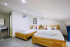 Postel nebo postele na pokoji v ubytování Lan Mạnh Hotel