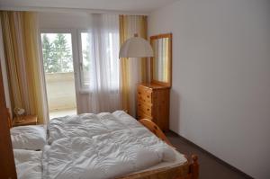 Voodi või voodid majutusasutuse Apartment in Disentis toas