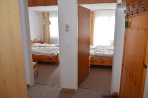 Voodi või voodid majutusasutuse Apartment in Disentis toas