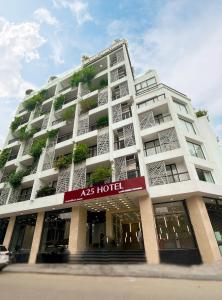 a large white building with hotel at A25 Hotel - 18 Nguyễn Hy Quang in Hanoi